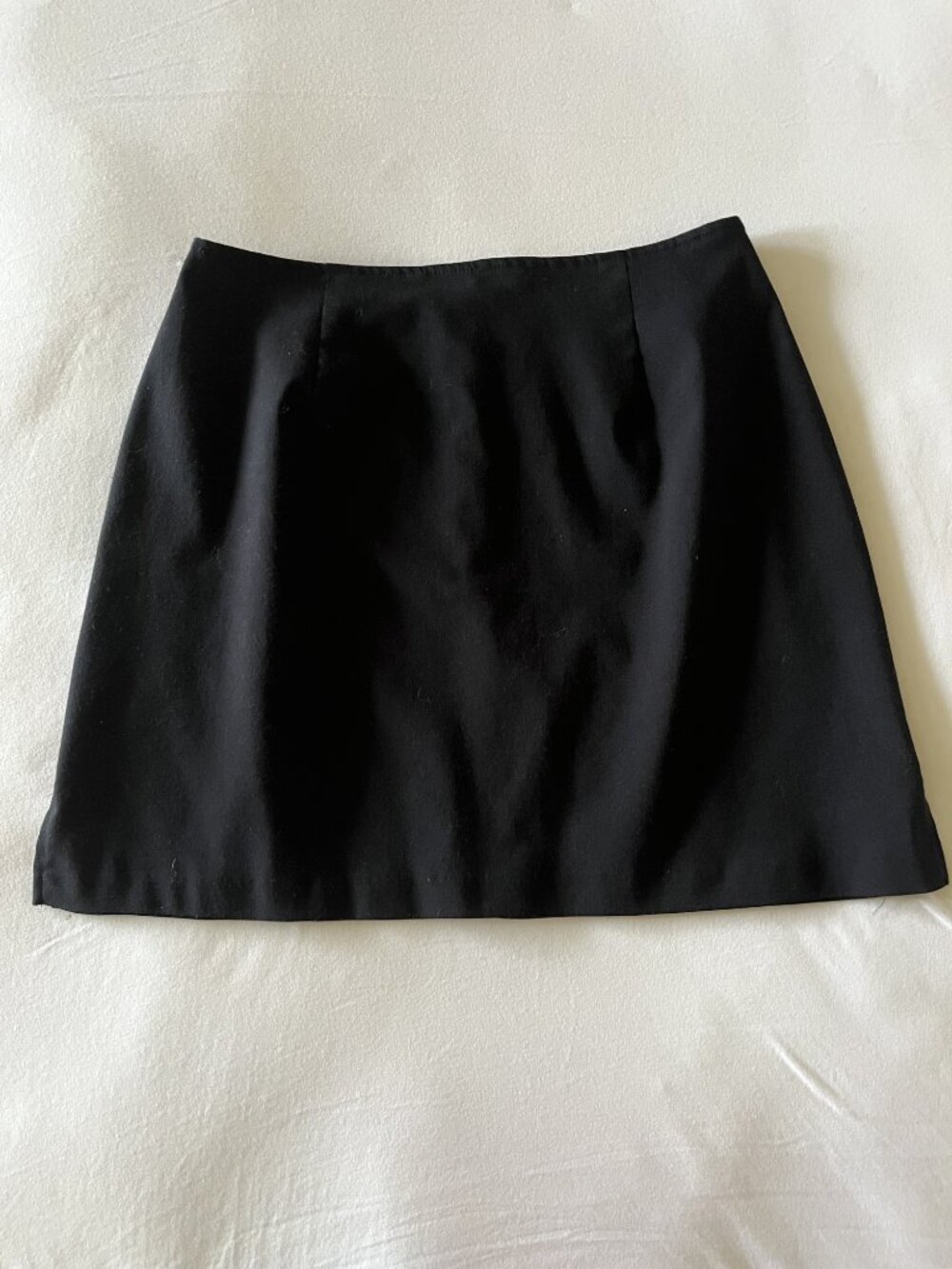 The Limited Vintage Black Mini Skirt with an A-Line silhouette